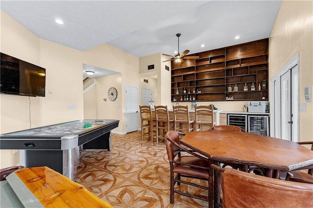 interior space with a ceiling fan, wine cooler, indoor wet bar, and recessed lighting