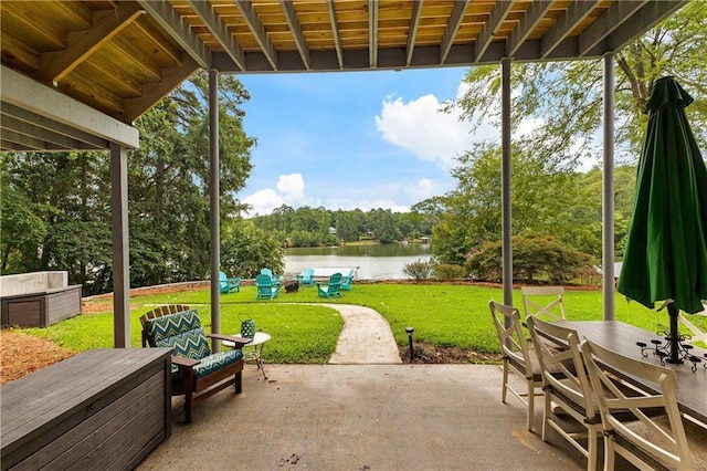 view of patio / terrace with outdoor dining space and a water view