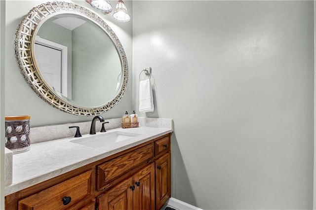 bathroom featuring vanity and baseboards