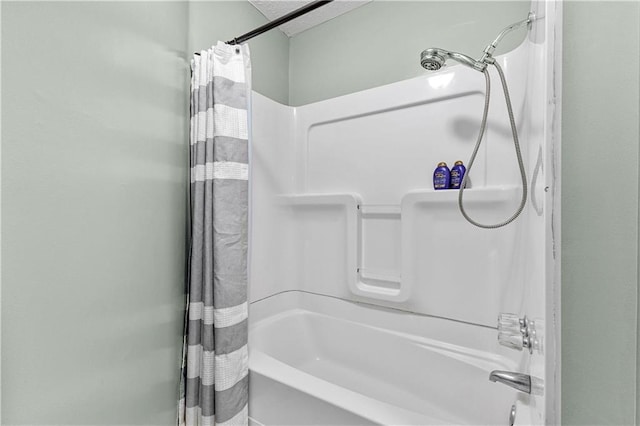 full bathroom with shower / bath combo with shower curtain