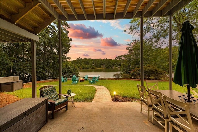 view of patio / terrace featuring a water view and outdoor dining space