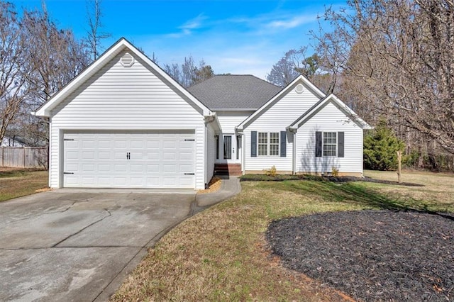 ranch-style house featuring a garage and a front yard