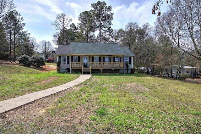 view of front of home with a wooden deck and a front yard