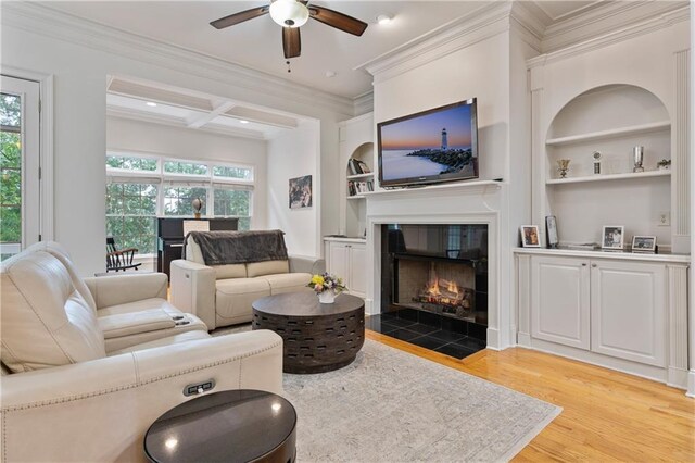 1003 Pearl Pt NE, Sandy Springs, GA 30328 - living room featuring a fireplace, ceiling fan, wood finished floors, built in shelves, and coffered ceiling