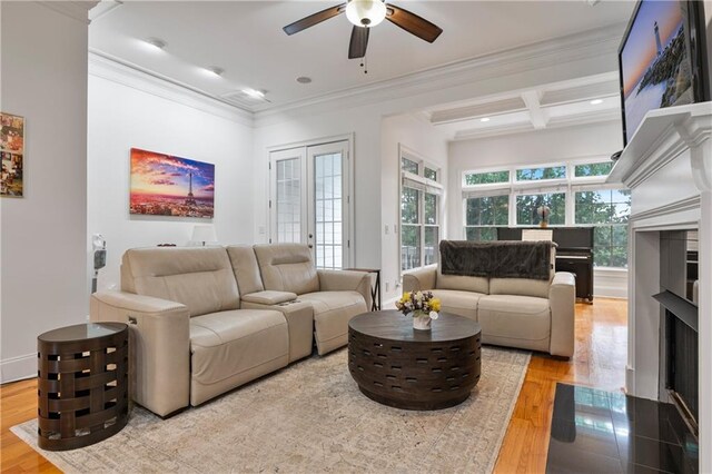 1003 Pearl Pt NE, Sandy Springs, GA 30328 - living room featuring a ceiling fan, crown molding, wood finished floors, a fireplace with flush hearth, and beam ceiling