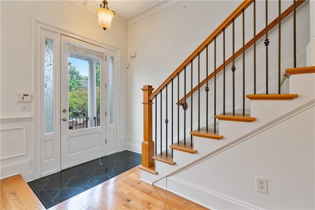 1003 Pearl Pt NE, Sandy Springs, GA 30328 - entrance foyer featuring wood finished floors, stairs, and crown molding