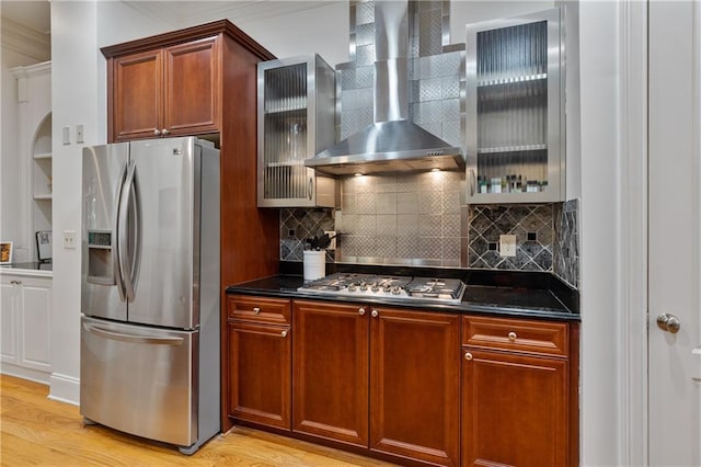 1003 Pearl Pt NE, Sandy Springs, GA 30328 - kitchen with stainless steel appliances, wall chimney range hood, light wood-type flooring, glass insert cabinets, and ornamental molding