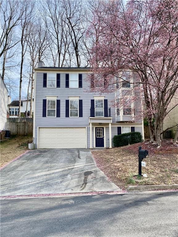 5105 N Bridges Dr, Alpharetta, GA 30022 - colonial inspired home with asphalt driveway, a garage, and a chimney