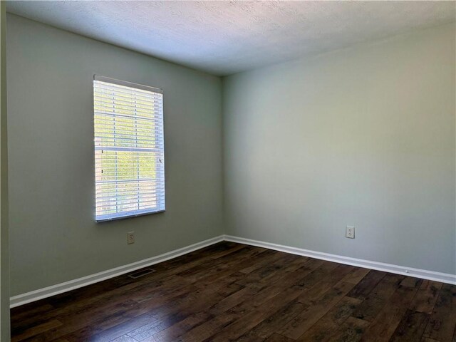 5105 N Bridges Dr, Alpharetta, GA 30022 - spare room with dark wood finished floors and baseboards