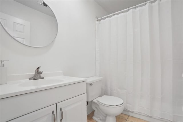 bathroom with tile patterned floors, vanity, toilet, and a shower with curtain