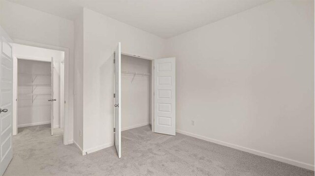 13917 Homer Ln, Covington, GA 30014 - unfurnished bedroom with carpet floors, baseboards, and a closet