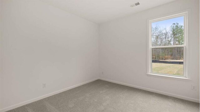 13917 Homer Ln, Covington, GA 30014 - carpeted empty room featuring baseboards, visible vents, and plenty of natural light