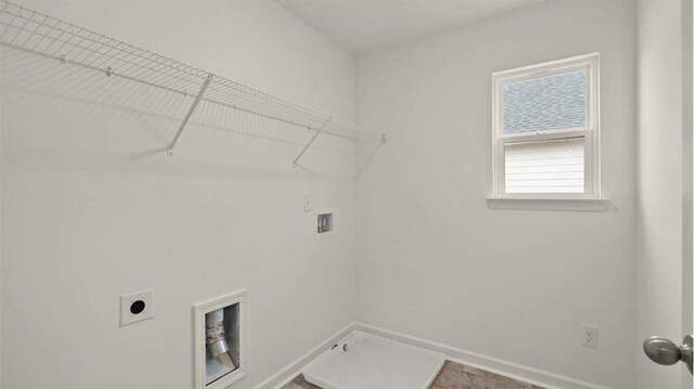 13917 Homer Ln, Covington, GA 30014 - laundry room featuring washer hookup, baseboards, laundry area, and electric dryer hookup