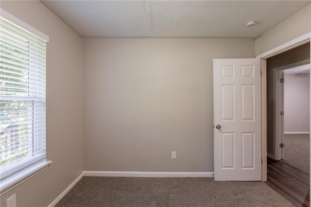 4650 Big Valley Ct, Stone Mountain, GA 30083 - carpeted empty room featuring plenty of natural light, baseboards, and a smoke detector