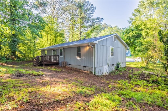 4650 Big Valley Ct, Stone Mountain, GA 30083 - view of front facade featuring crawl space, a deck, cooling unit, and board and batten siding