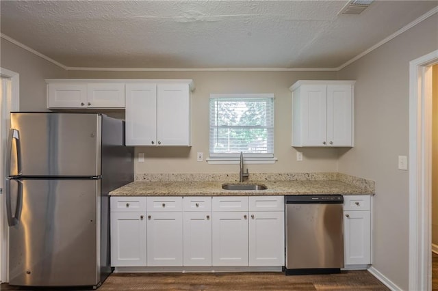 4650 Big Valley Ct, Stone Mountain, GA 30083 - kitchen with stainless steel appliances, a sink, dark wood finished floors, white cabinetry, and light stone counters
