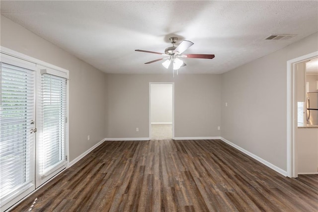 4650 Big Valley Ct, Stone Mountain, GA 30083 - unfurnished room featuring ceiling fan, wood finished floors, baseboards, and a textured ceiling
