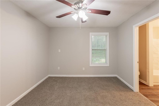 4650 Big Valley Ct, Stone Mountain, GA 30083 - carpeted spare room featuring baseboards and ceiling fan
