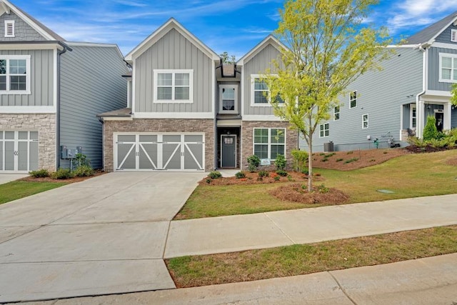 view of front of property with a garage and a front lawn