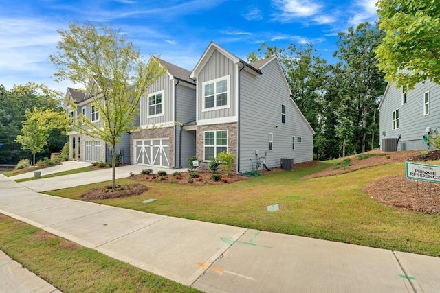 view of front of house with a garage and a front yard