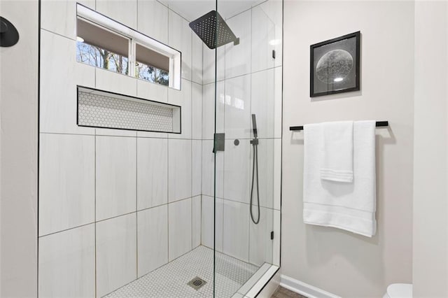 bathroom with a tile shower