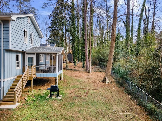 view of yard featuring a sunroom