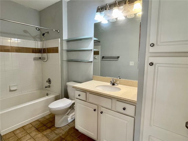 full bathroom with vanity, tiled shower / bath combo, and toilet