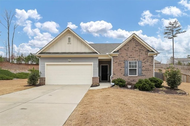 view of front of property featuring a garage and a front lawn