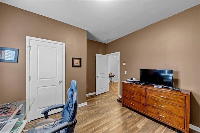 home office with light wood-type flooring