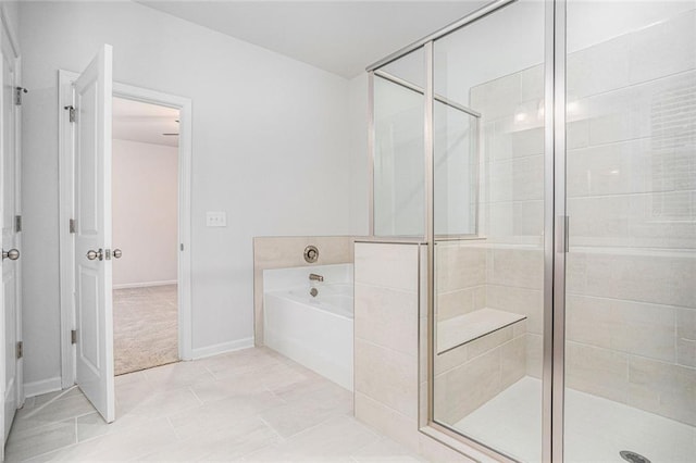 bathroom featuring shower with separate bathtub and tile patterned floors