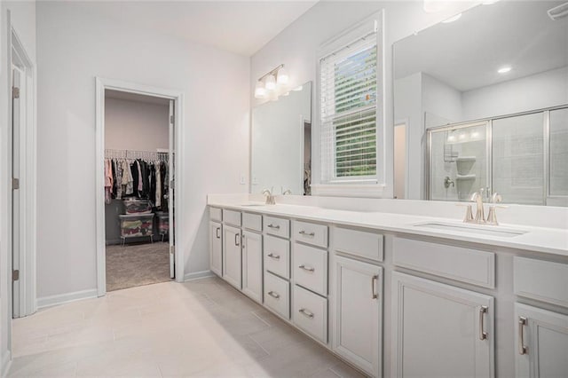 bathroom with vanity, tile patterned floors, and an enclosed shower