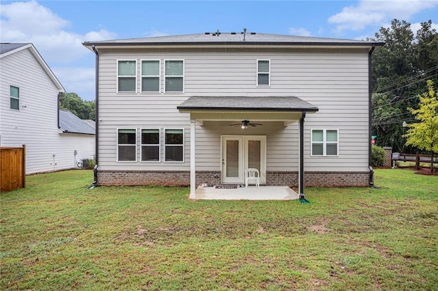 back of property featuring a patio area, a yard, and ceiling fan