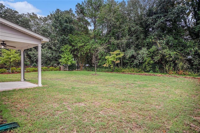 view of yard featuring ceiling fan