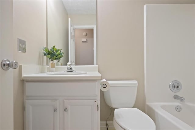 full bathroom with vanity, a textured ceiling, toilet, and shower / bath combination