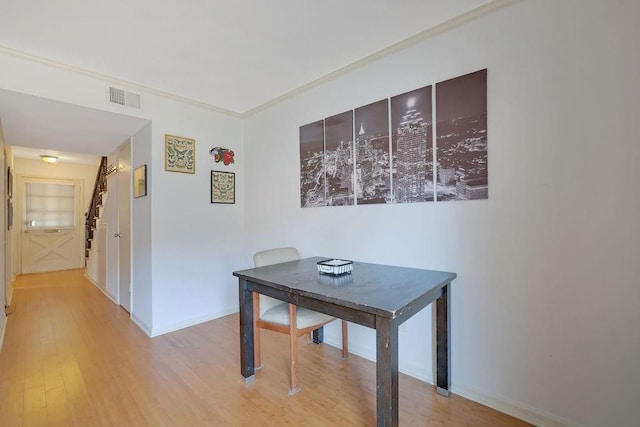 interior space featuring light hardwood / wood-style flooring and ornamental molding