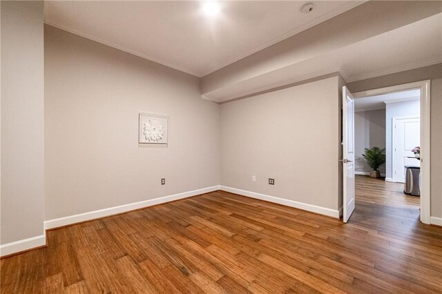 interior space with wood-type flooring and crown molding