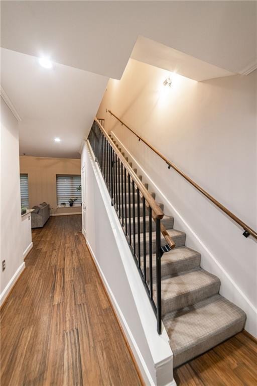 staircase featuring hardwood / wood-style flooring