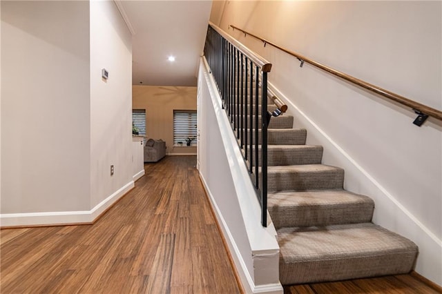 stairway with hardwood / wood-style floors