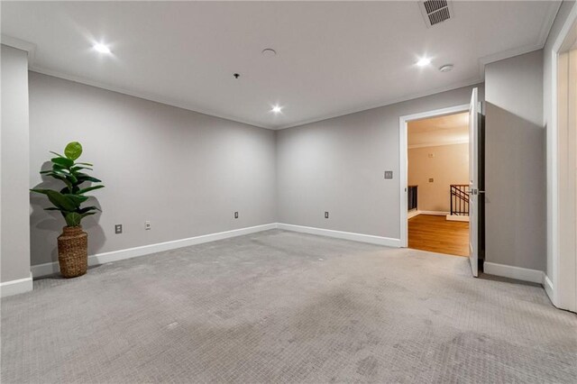 carpeted spare room with ornamental molding