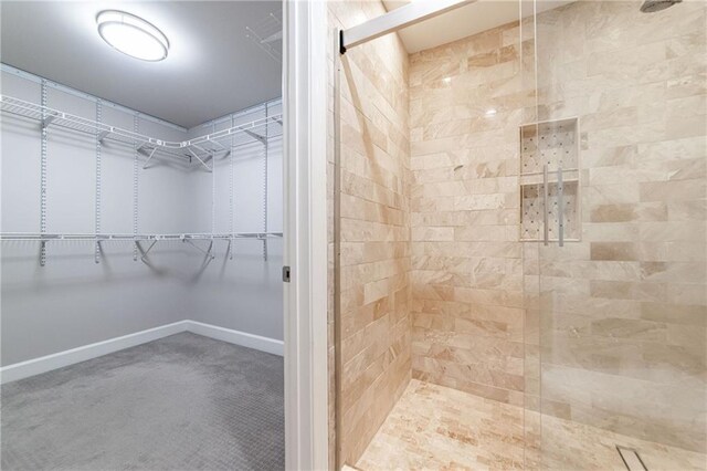 bathroom with tiled shower