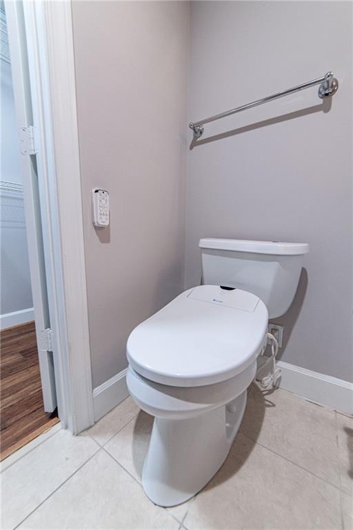 bathroom featuring tile patterned flooring and toilet