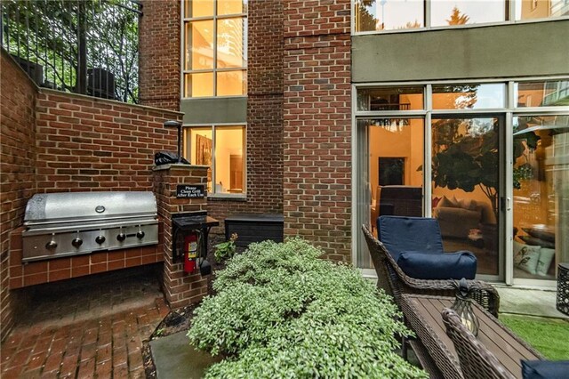 view of patio with an outdoor kitchen and area for grilling