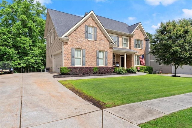 1050 Double Branches Ln, Dallas, GA 30132 - craftsman-style home featuring brick siding, a garage, a front lawn, and concrete driveway