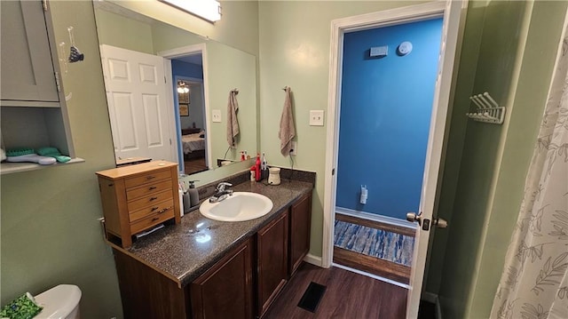 112 Hilltop Dr, Newborn, GA 30056 - full bathroom featuring vanity, wood finished floors, connected bathroom, baseboards, and toilet