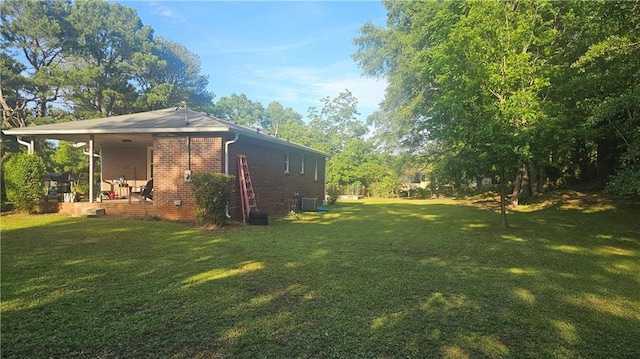 112 Hilltop Dr, Newborn, GA 30056 - view of home's exterior featuring a yard, central air condition unit, and brick siding