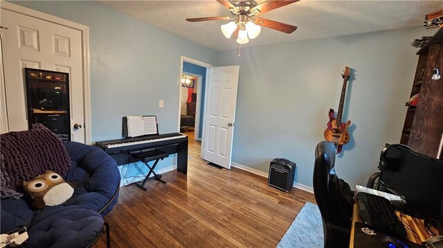 112 Hilltop Dr, Newborn, GA 30056 - office featuring a ceiling fan, wood finished floors, baseboards, and a textured ceiling