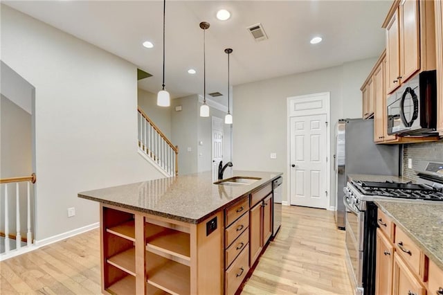 1668 Sabastian Pt NE, Atlanta, GA 30329 - kitchen featuring a sink, appliances with stainless steel finishes, open shelves, and light wood-style flooring
