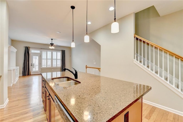 1668 Sabastian Pt NE, Atlanta, GA 30329 - kitchen with a ceiling fan, a kitchen island with sink, light wood-style floors, a sink, and dishwasher