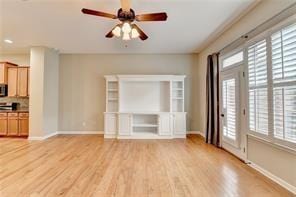 1668 Sabastian Pt NE, Atlanta, GA 30329 - unfurnished living room featuring a ceiling fan, baseboards, and light wood finished floors