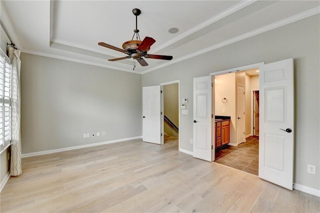 1668 Sabastian Pt NE, Atlanta, GA 30329 - unfurnished bedroom with crown molding, multiple windows, and a tray ceiling